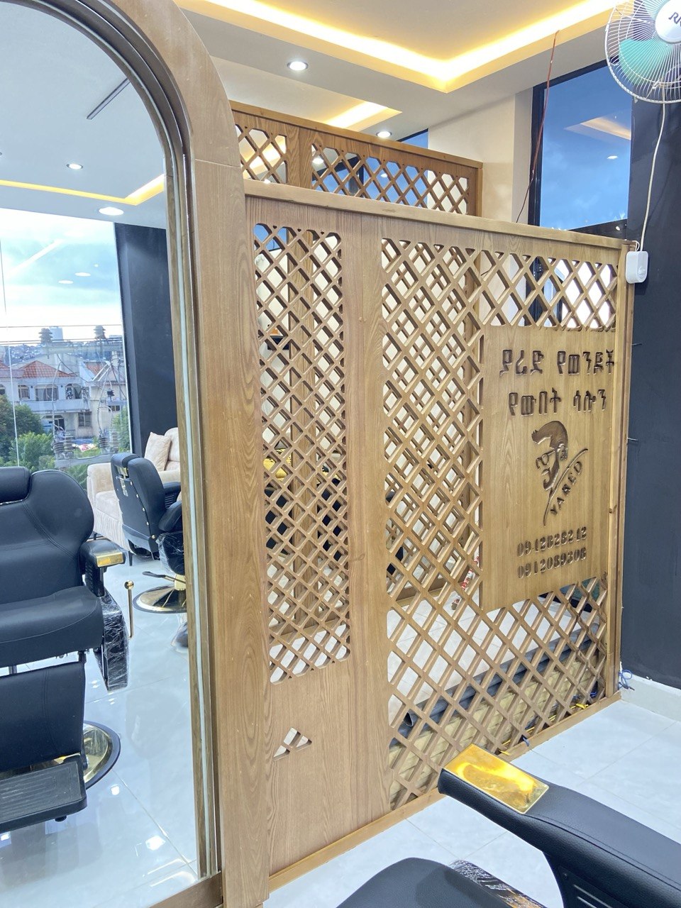 Carved wooden Amharic signage — Yared brand